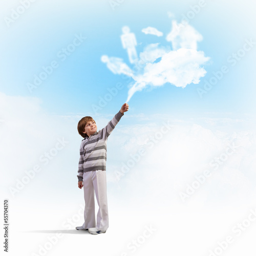 Cute boy catching clouds
