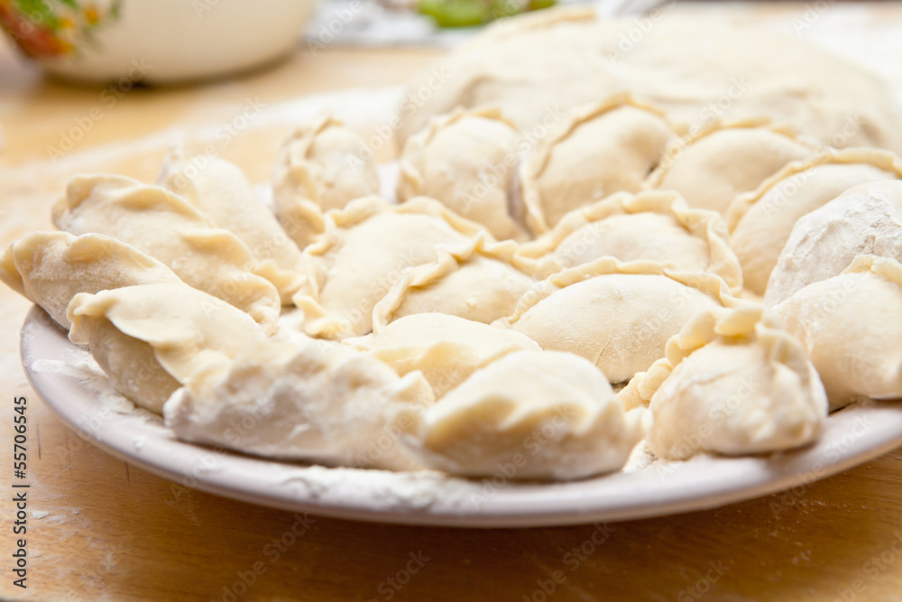 uncooked dumplings on the table uncooked dumplings on the table