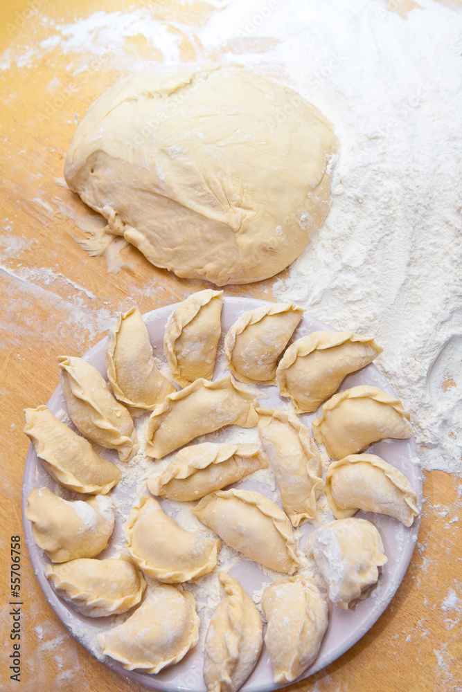 uncooked dumplings on the table uncooked dumplings on the table