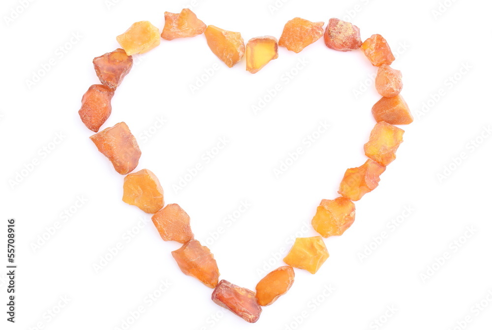 Heart of raw ambers on white background Heart of raw ambers on white background