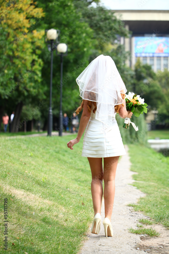 Fototapeta premium Beautiful red hair bride wearing wedding dress