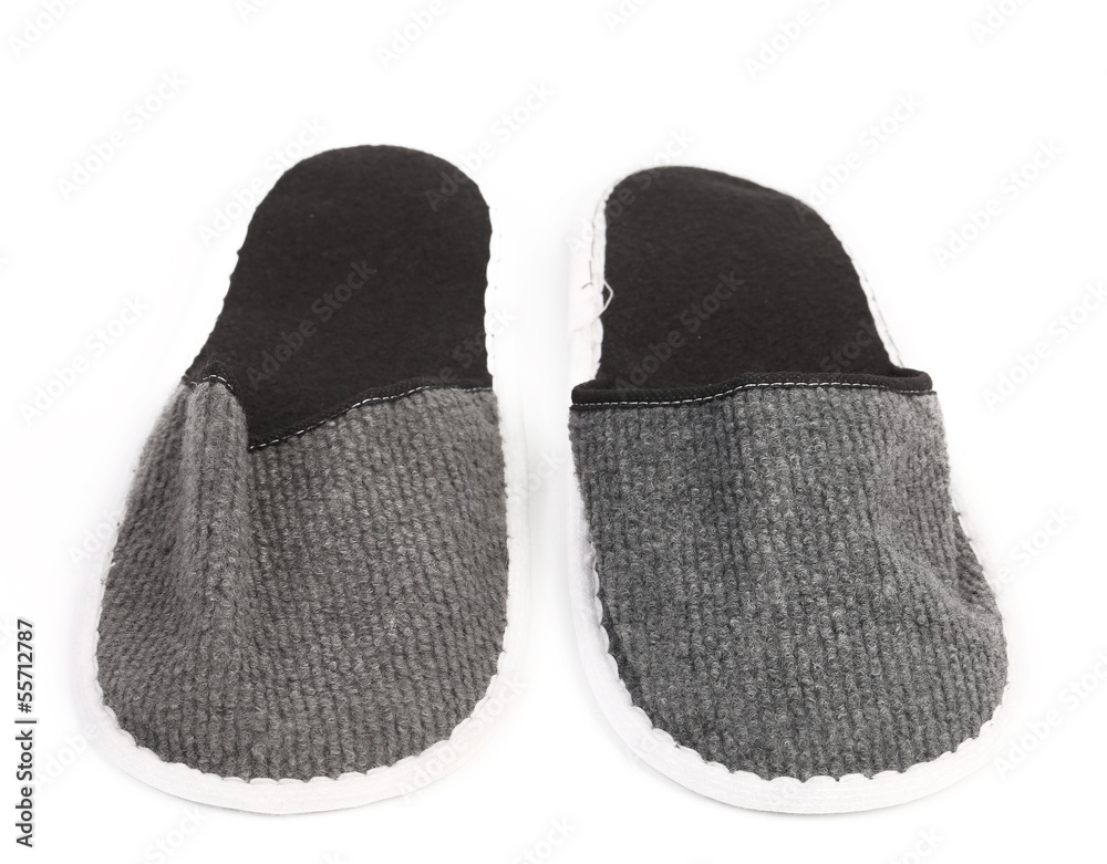 Pair of gray slippers on a white background. Pair of gray slippers on a white background.