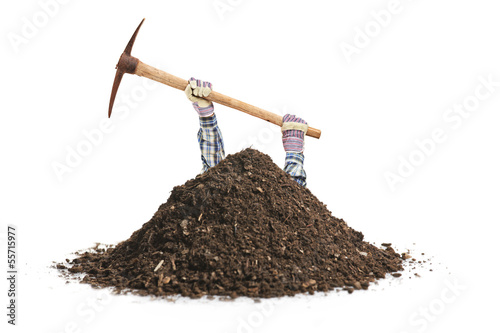 Canvas Print Male manual worker digging a hole