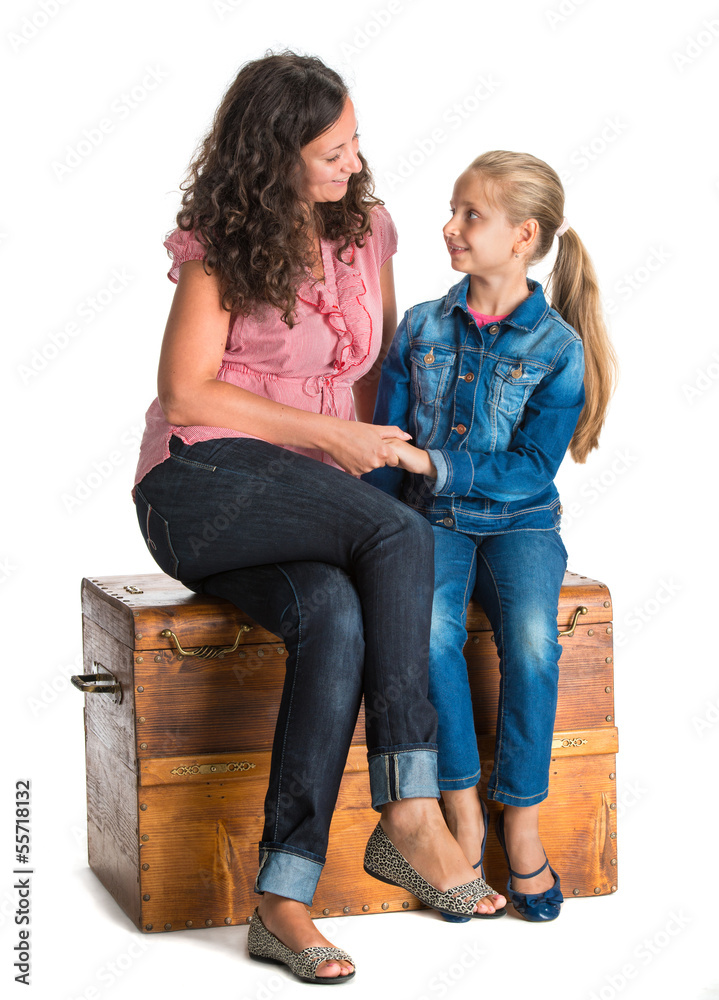 Smiling mother and daughter looking into each other Smiling mother and daughter looking into each other