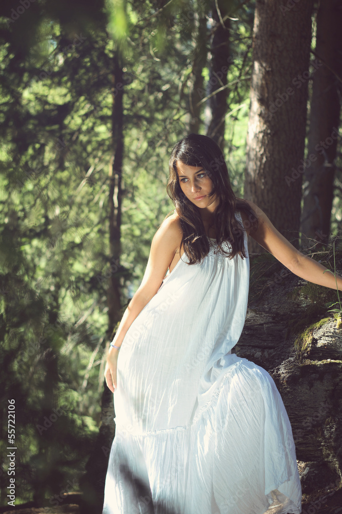 Elegant and beautiful girl posing in a forest Elegant and beautiful girl posing in a forest