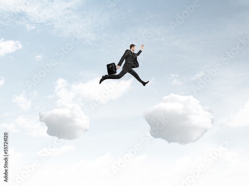 man jumping from cloud