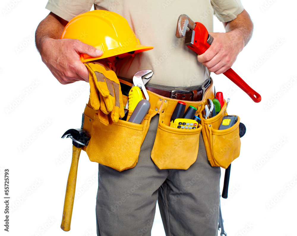 Handyman with a tool belt. Stock Photo | Adobe Stock