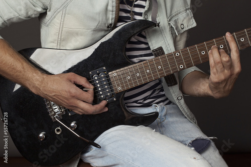 musician playing guitar photo
