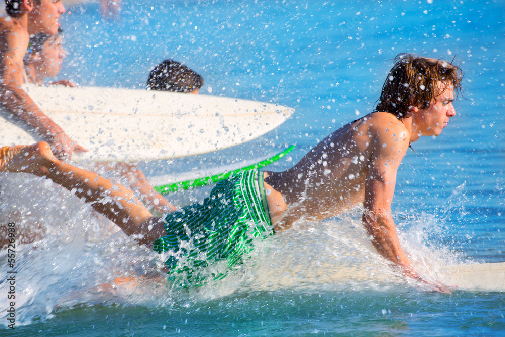Boys surfers surfing running jumping on surfboards