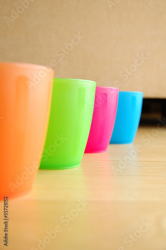 Colourful plastic mugs