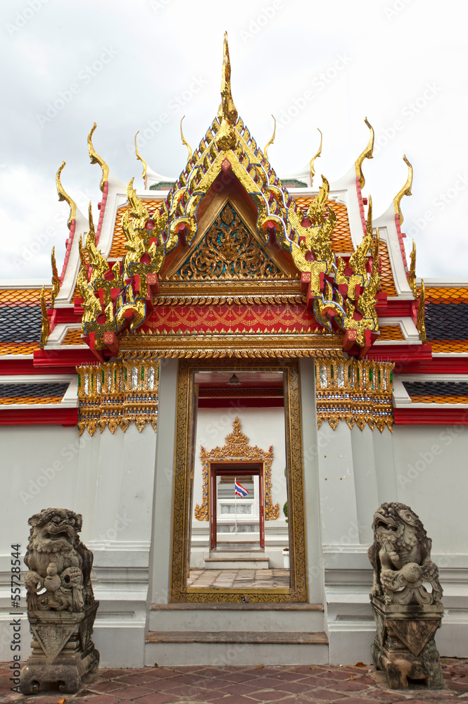 Fototapeta premium Temple door, carving golden wooden temple door