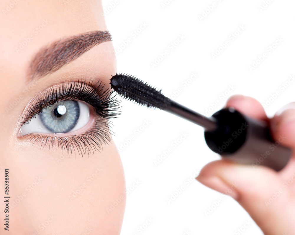 Fototapeta premium woman applying mascara on eyelashes