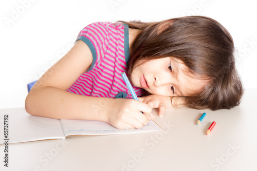 Child writing at desk