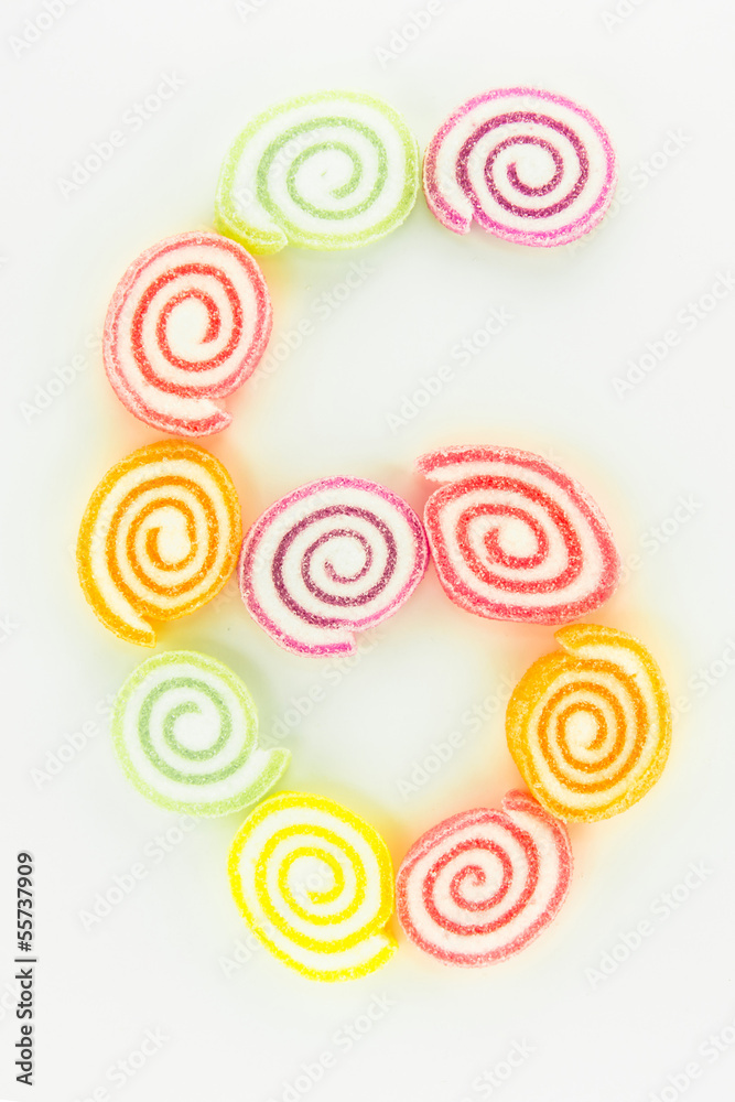 number 6 written with slices of dried sweet candies number 6 written with slices of dried sweet candies