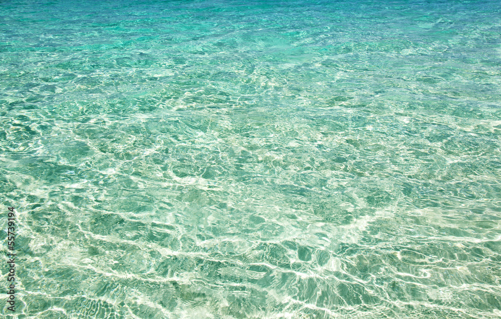 the surface of the turquoise sea