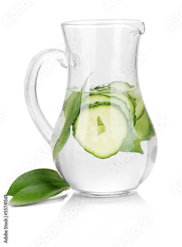 Cold water with cucumber and ice in pitchers isolated on white