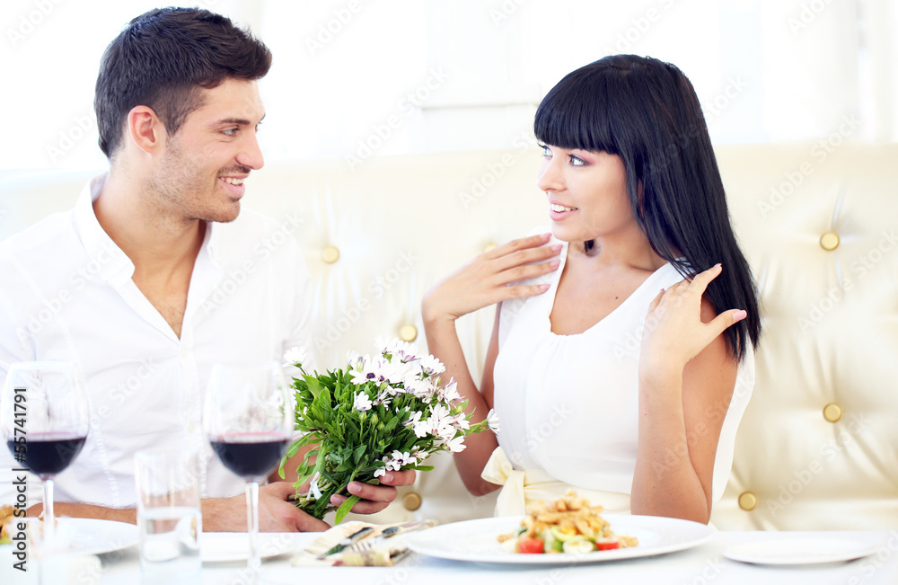 Beautiful couple having  romantic dinner at restaurant