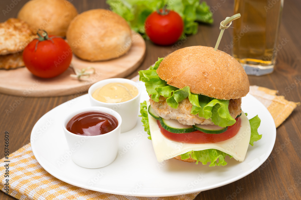 homemade chicken burger with ketchup and mustard homemade chicken burger with ketchup and mustard