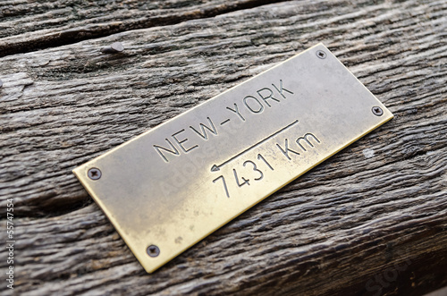 Distance Sign On Wood To New York City