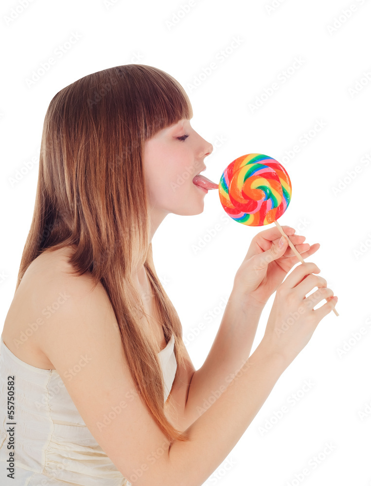 Pretty Young girl licking a lollipop