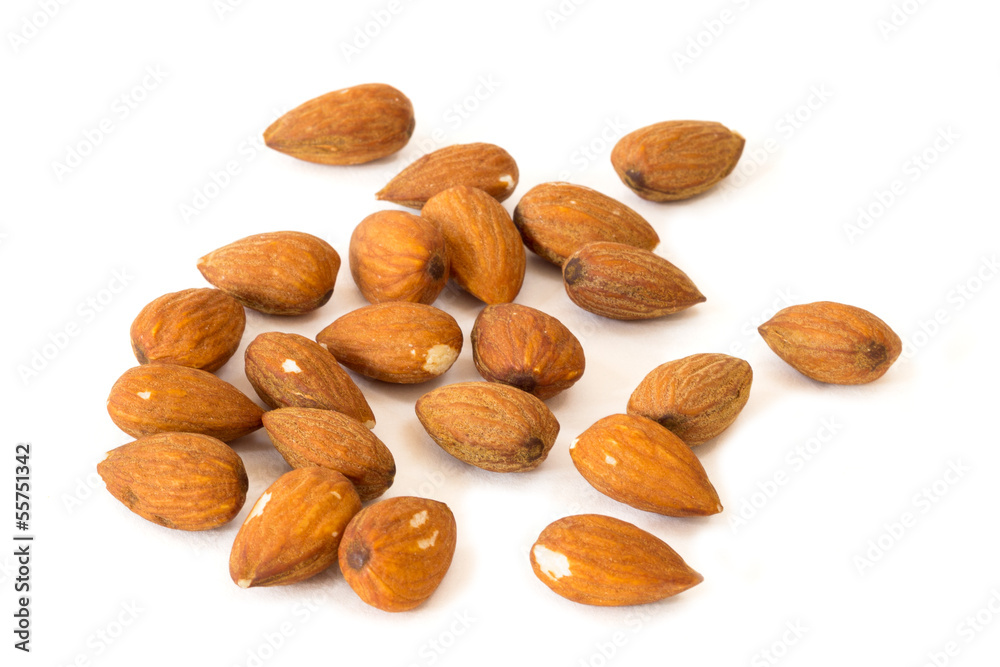Closeup of several almond seeds, isolated on white background Closeup of several almond seeds, isolated on white background