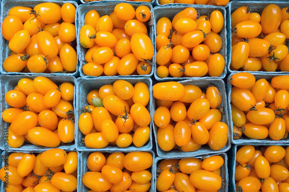 Yellow cherry tomatoes on sale at a farmer's market