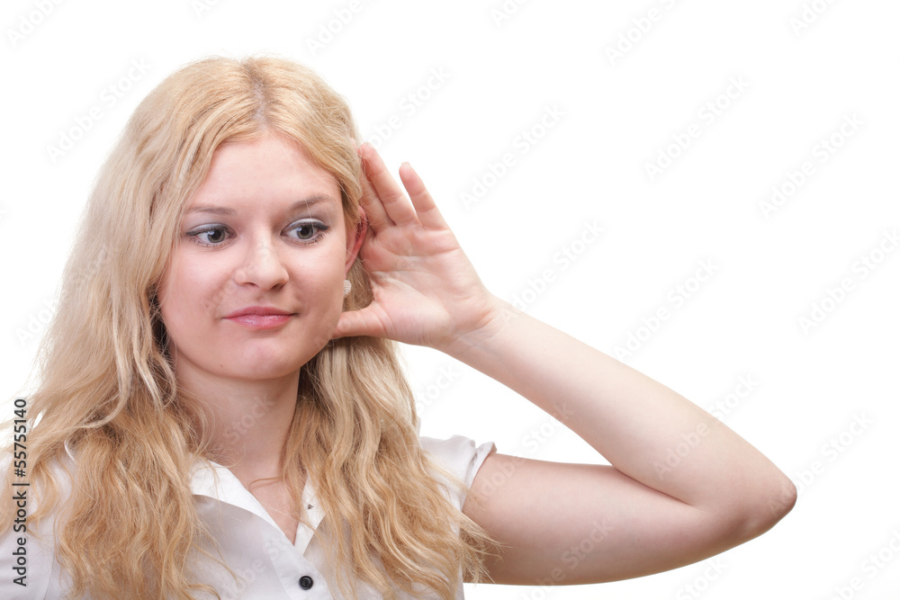 woman eavesdropping with hand behind her ear woman eavesdropping with hand behind her ear