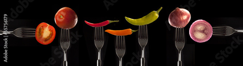 variety of foods presented on forks photo
