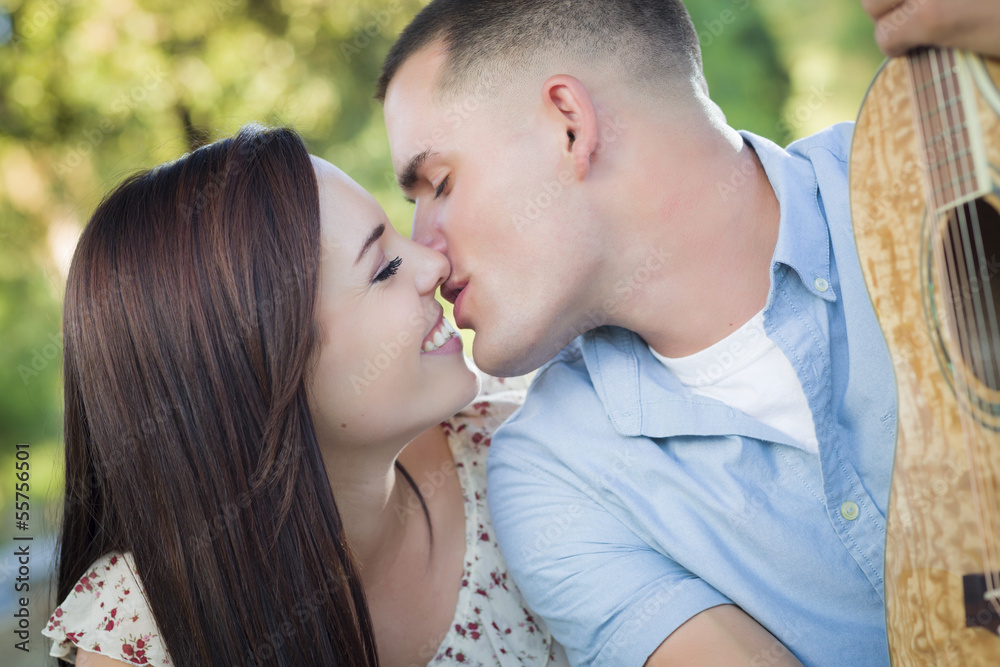 Mixed Race Couple Portrait with Guitar in Park Mixed Race Couple Portrait with Guitar in Park