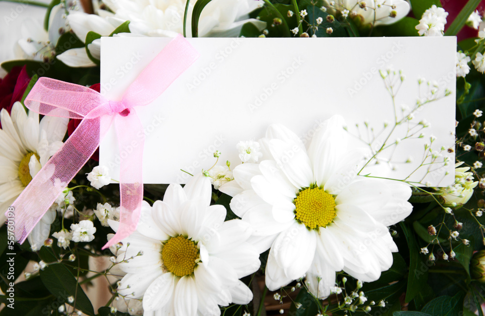 Obraz premium flowers with a white card