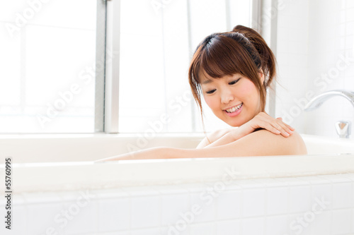 beautiful asian woman relaxing in the bath room