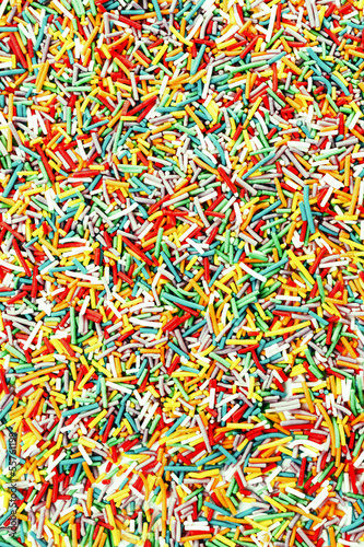Photo colorful neon sprinkles candies for background use, top v
