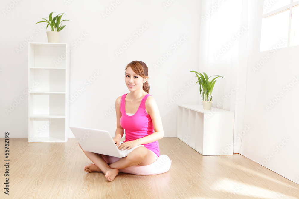 Young beautiful girl with a laptop at home Young beautiful girl with a laptop at home