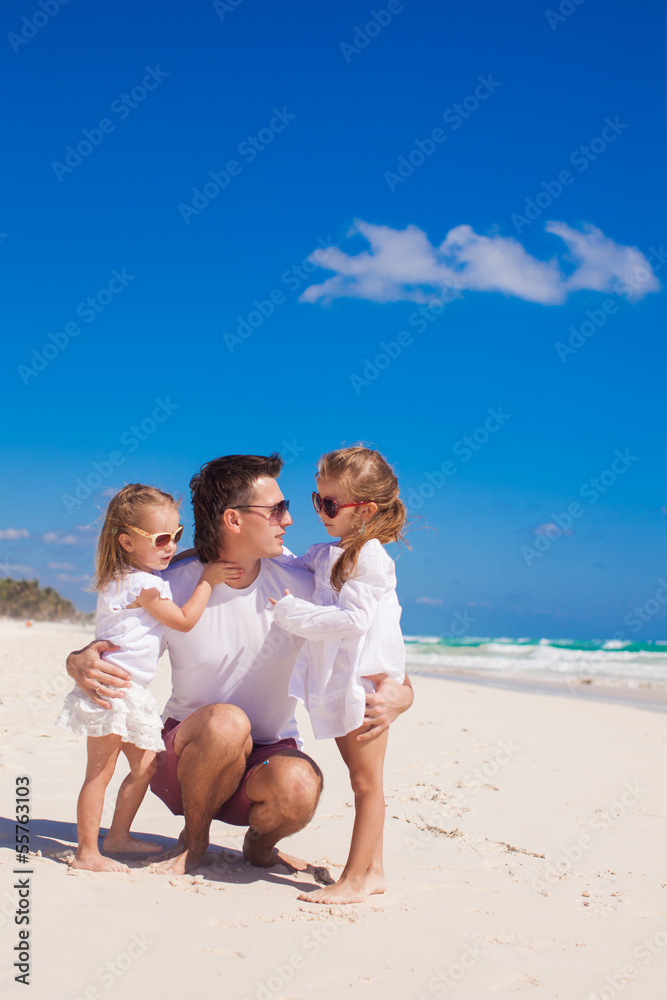 Happy father and his adorable little daughters on sunny day Happy father and his adorable little daughters on sunny day