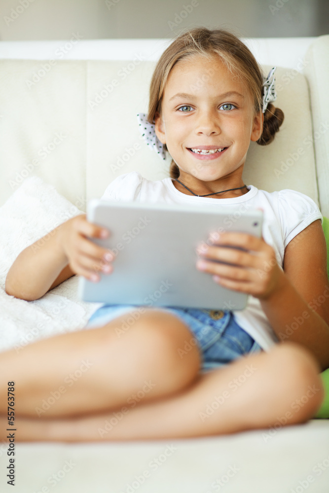Child playing on tablet pc