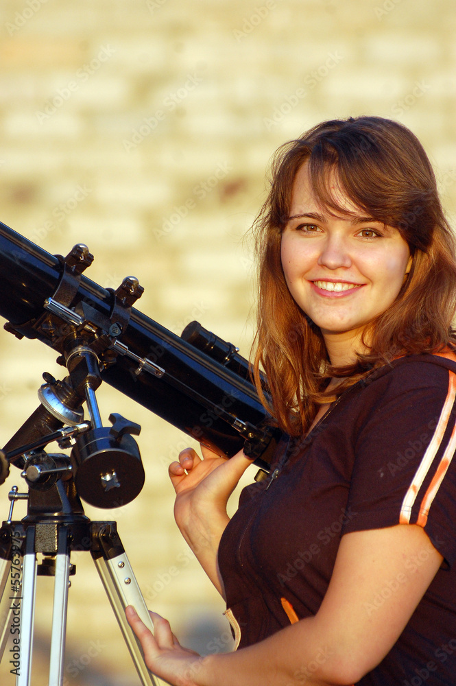 Obraz premium Teen girl and telescope, Near Kiev,Ukraine