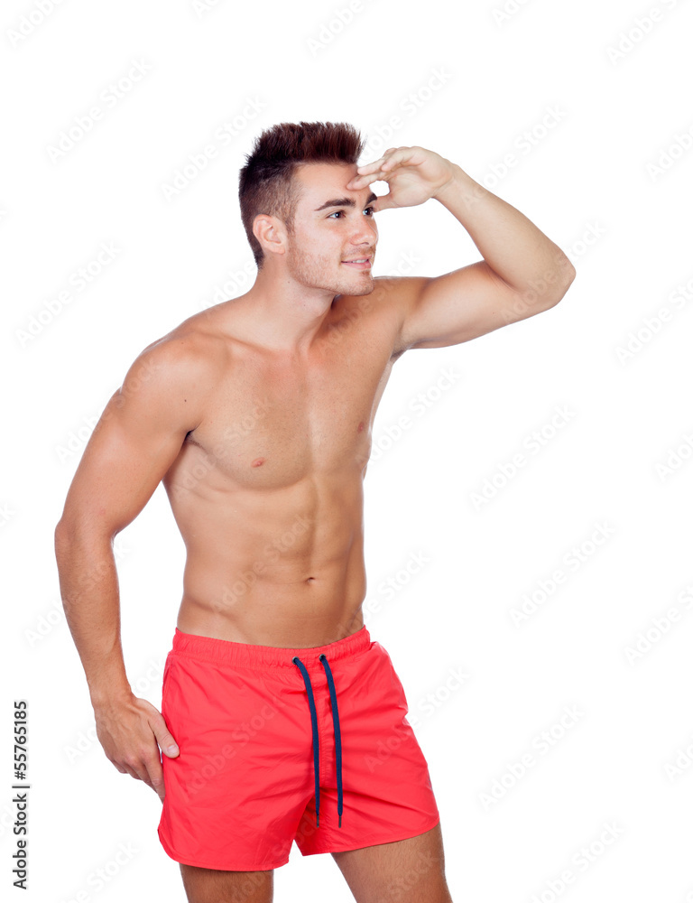 Fototapeta premium Handsome lifeguard with red swimsuit