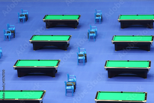 Rows of several billiard tables photo