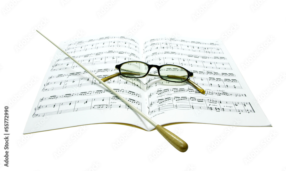 Fototapeta premium Baton and glasses on music score