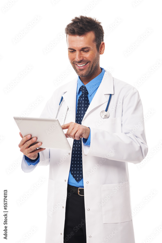 Male doctor working on digital tablet Male doctor working on digital tablet
