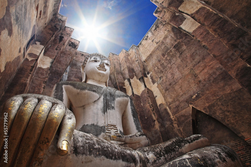 Big buddha against sunbeam at wat Srichum photo