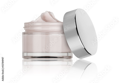 glass jar of beauty cream with cap, isolated