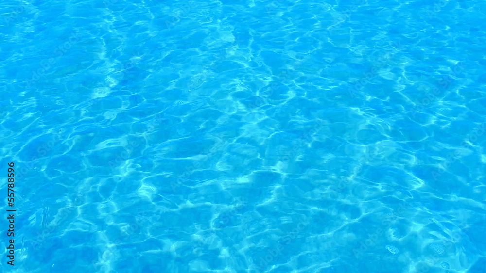 Beautiful refreshing blue swimming pool water Beautiful refreshing blue swimming pool water