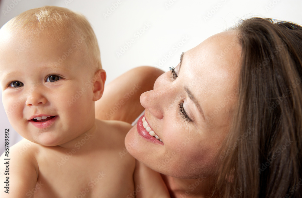 Portrait of a loving mother with happy baby Portrait of a loving mother with happy baby