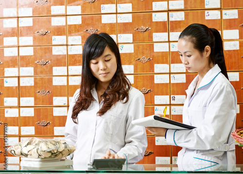 Photography Chinese pharmacy worker in china drugstore