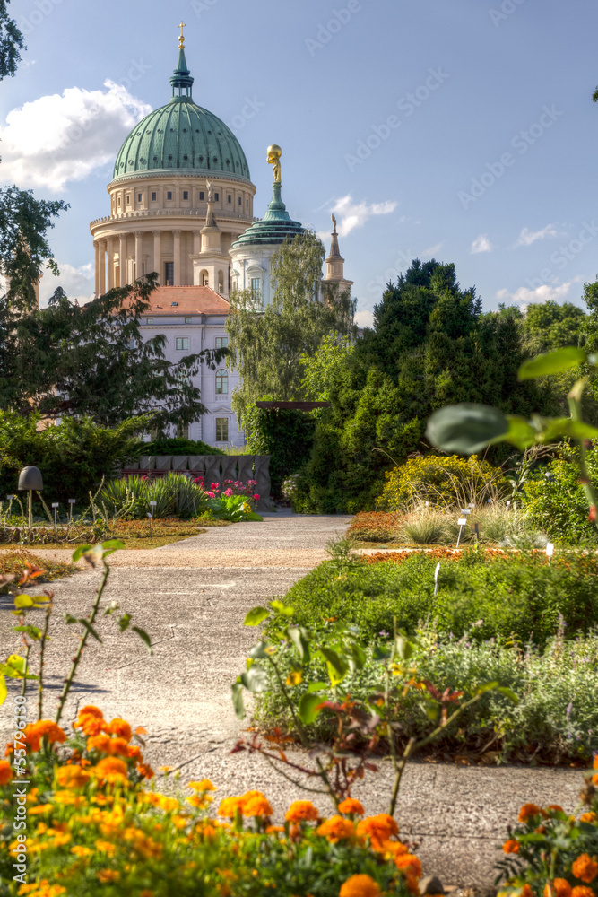 Naklejka premium Dome and old town hall in Potsdam behind a flowered park
