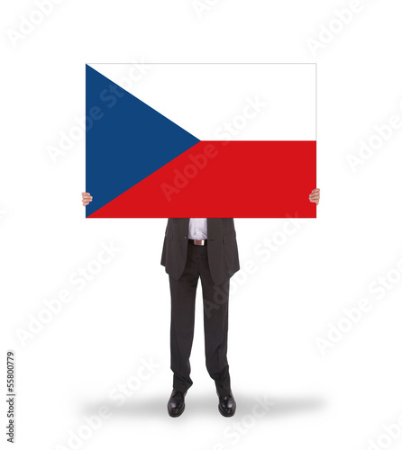 Smiling businessman holding a big card, flag of the Czech Republ photo