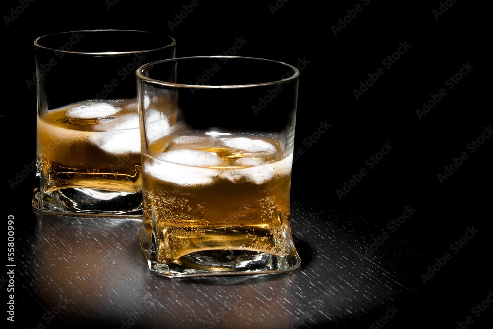 two glasses of long fresh drink with ice with space for text two glasses of long fresh drink with ice with space for text