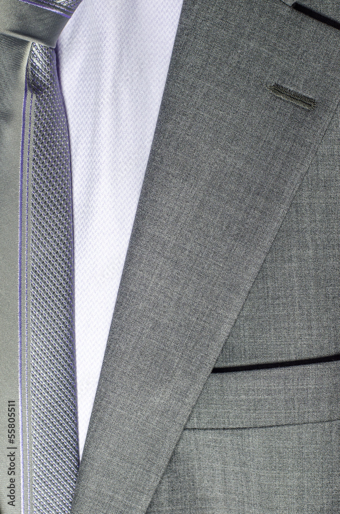 detail of a grey man suit with tie detail of a grey man suit with tie