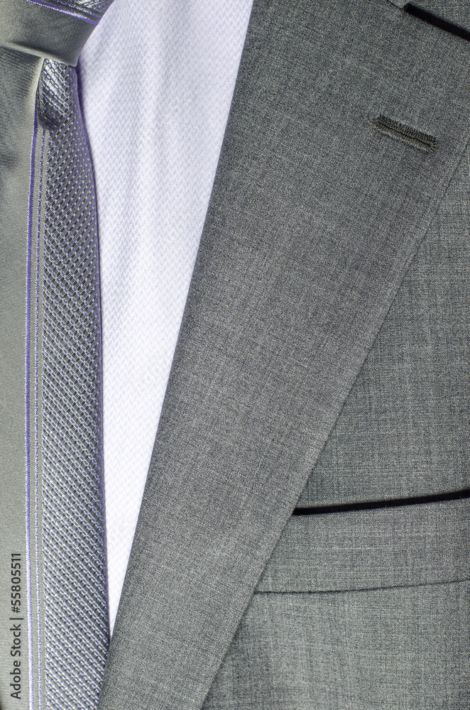 detail of a grey man suit with tie